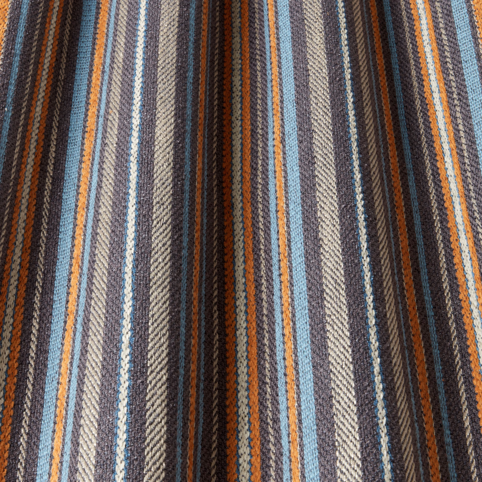 Striped woven fabric in navy, teal, rust and grey with textured finish
