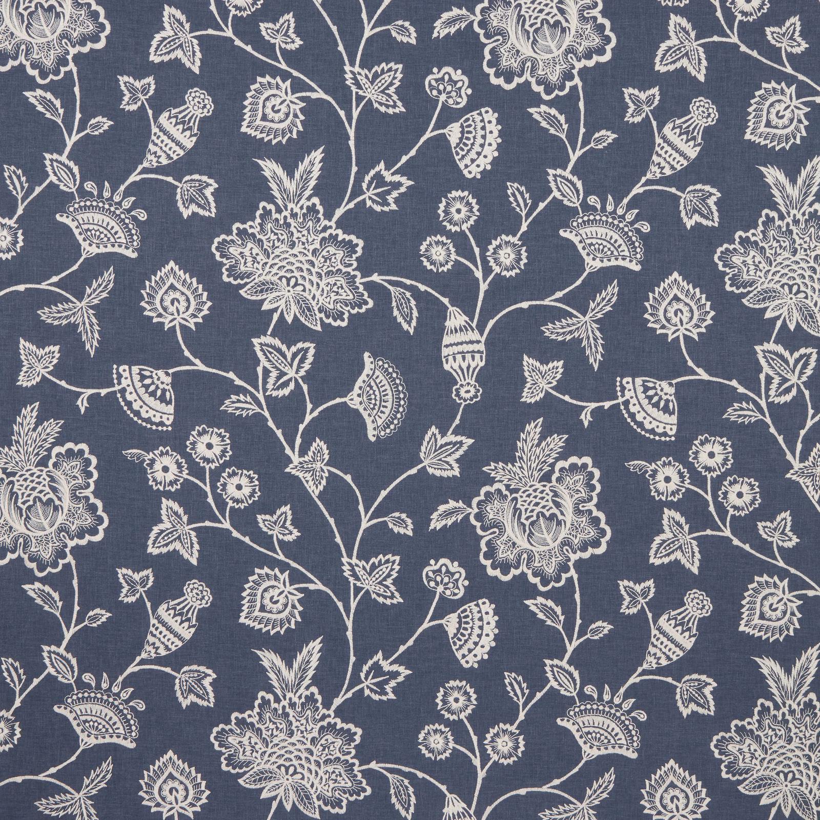 Blue fabric swatch with pale embroidered botanical vine and floral pattern