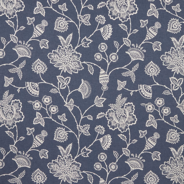 Blue fabric swatch with pale embroidered botanical vine and floral pattern