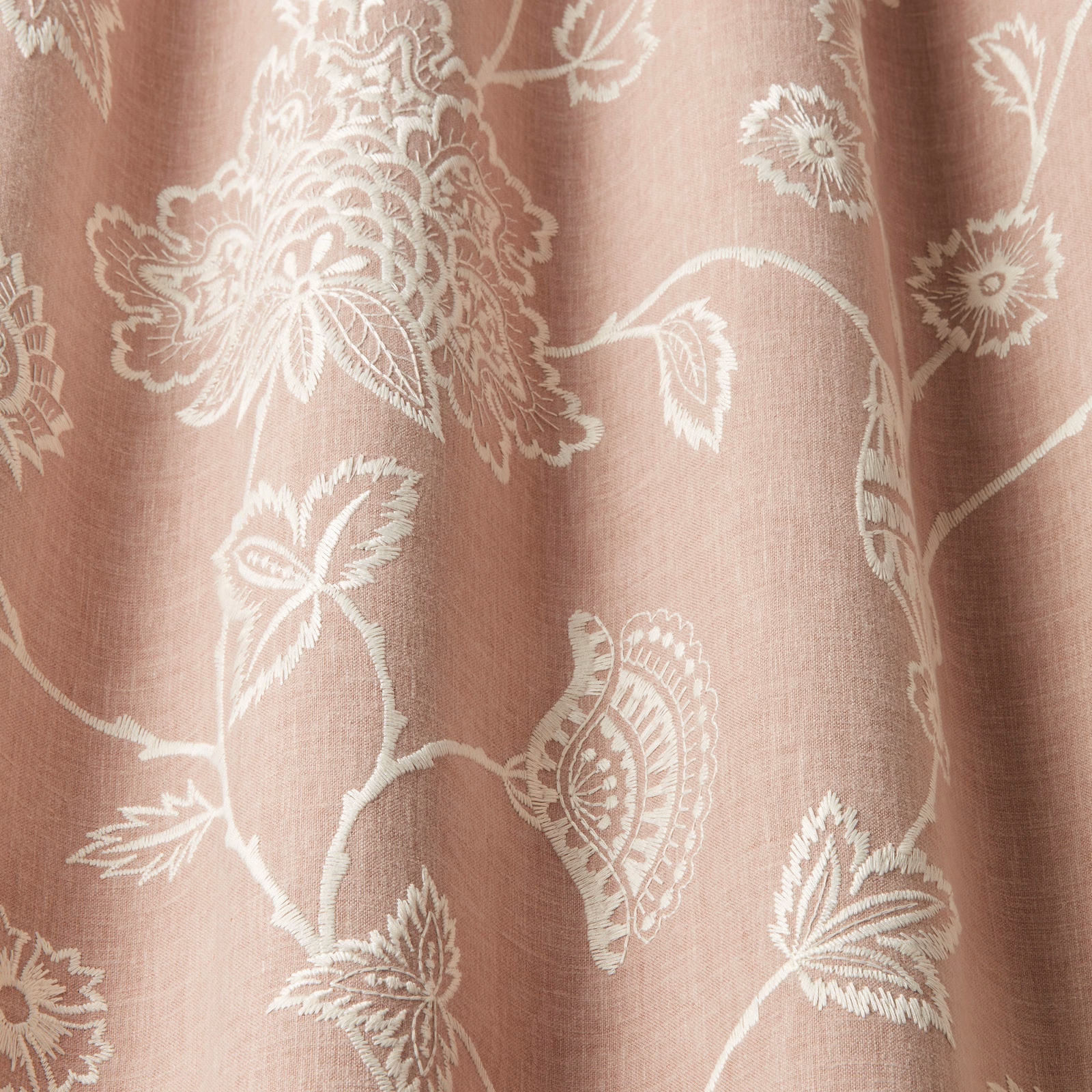 Soft orchid pink fabric with creamy embroidered floral scrolls and large motifs