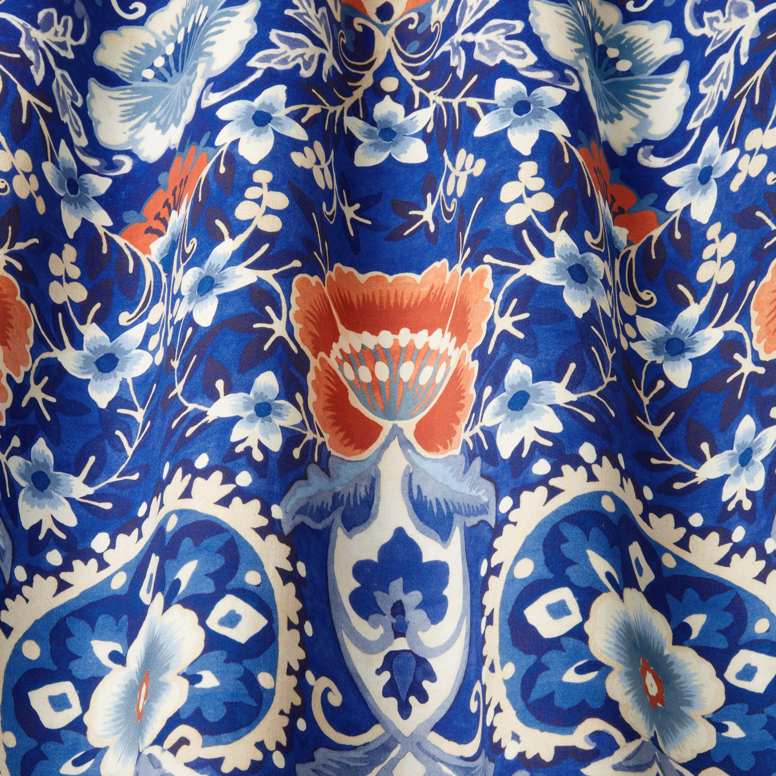 Cobalt blue cotton fabric with large batik floral and scroll motif