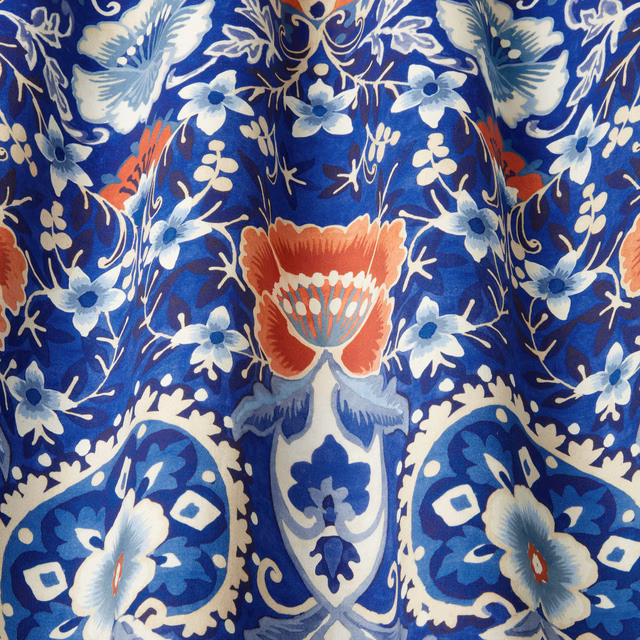Cobalt blue cotton fabric with large batik floral and scroll motif