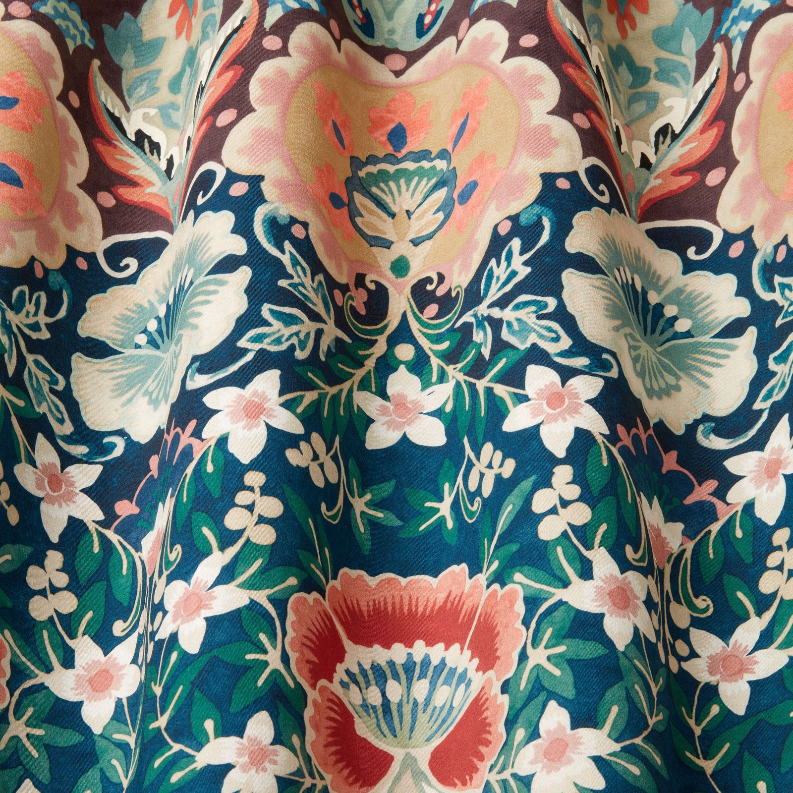 Deep teal floral cotton fabric with cream, pink and coral motifs