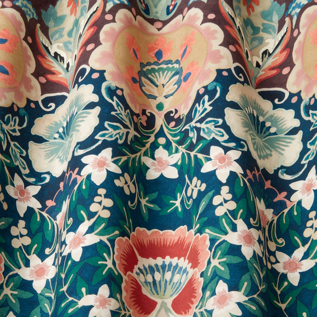 Deep teal floral cotton fabric with cream, pink and coral motifs