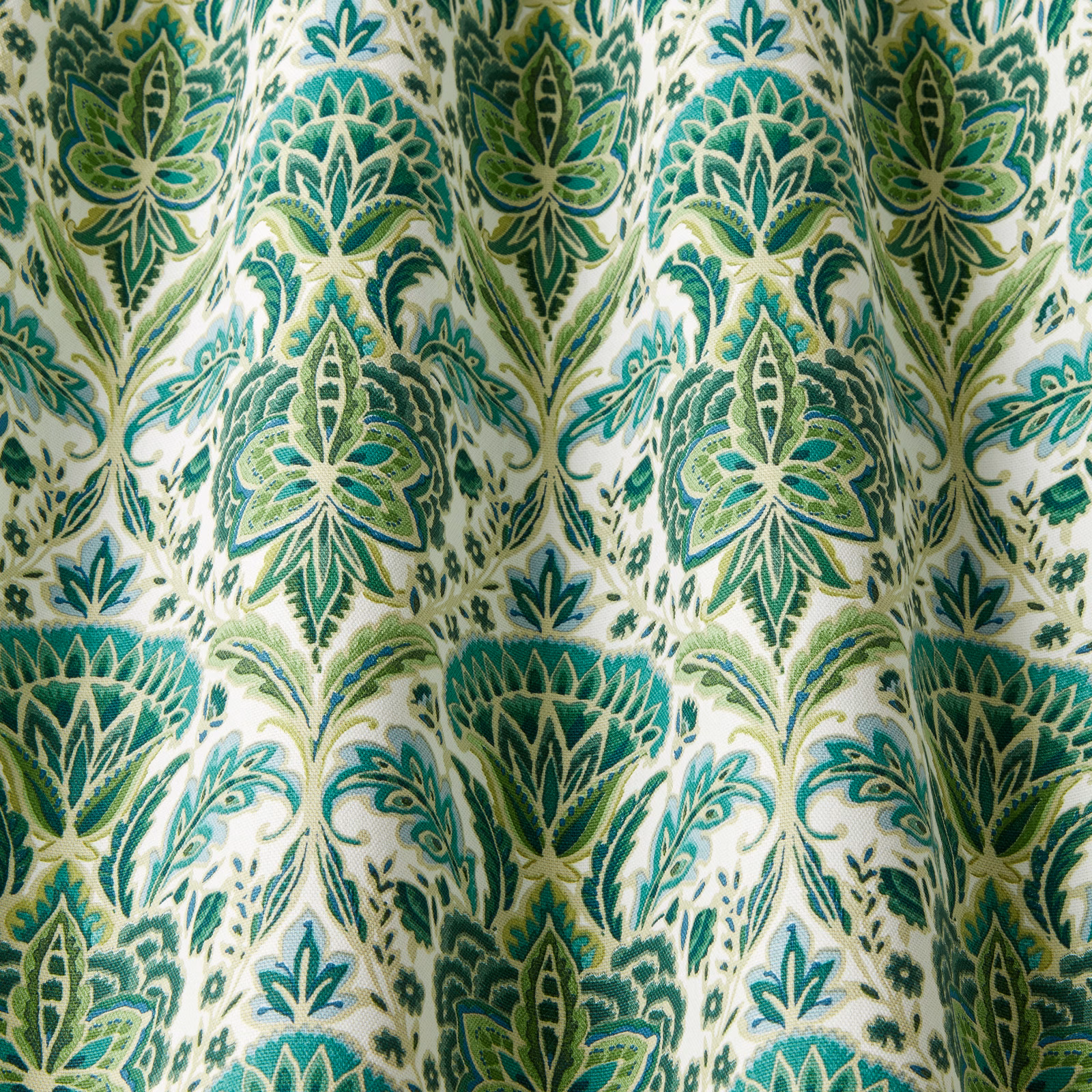 Cream cotton fabric with large absinthe green wavy botanical medallions