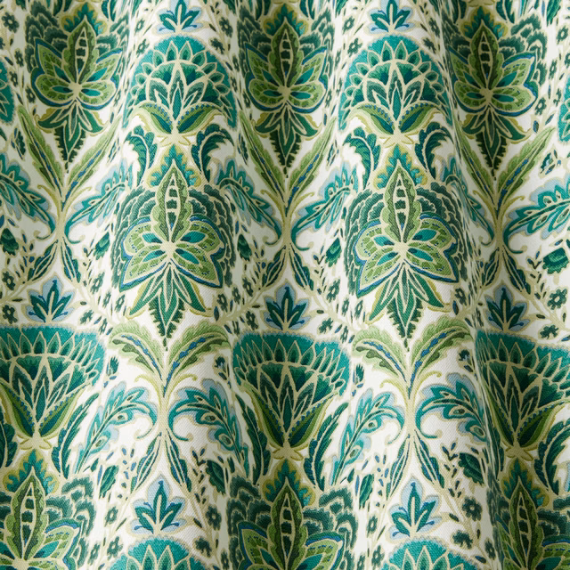 Cream cotton fabric with large absinthe green wavy botanical medallions