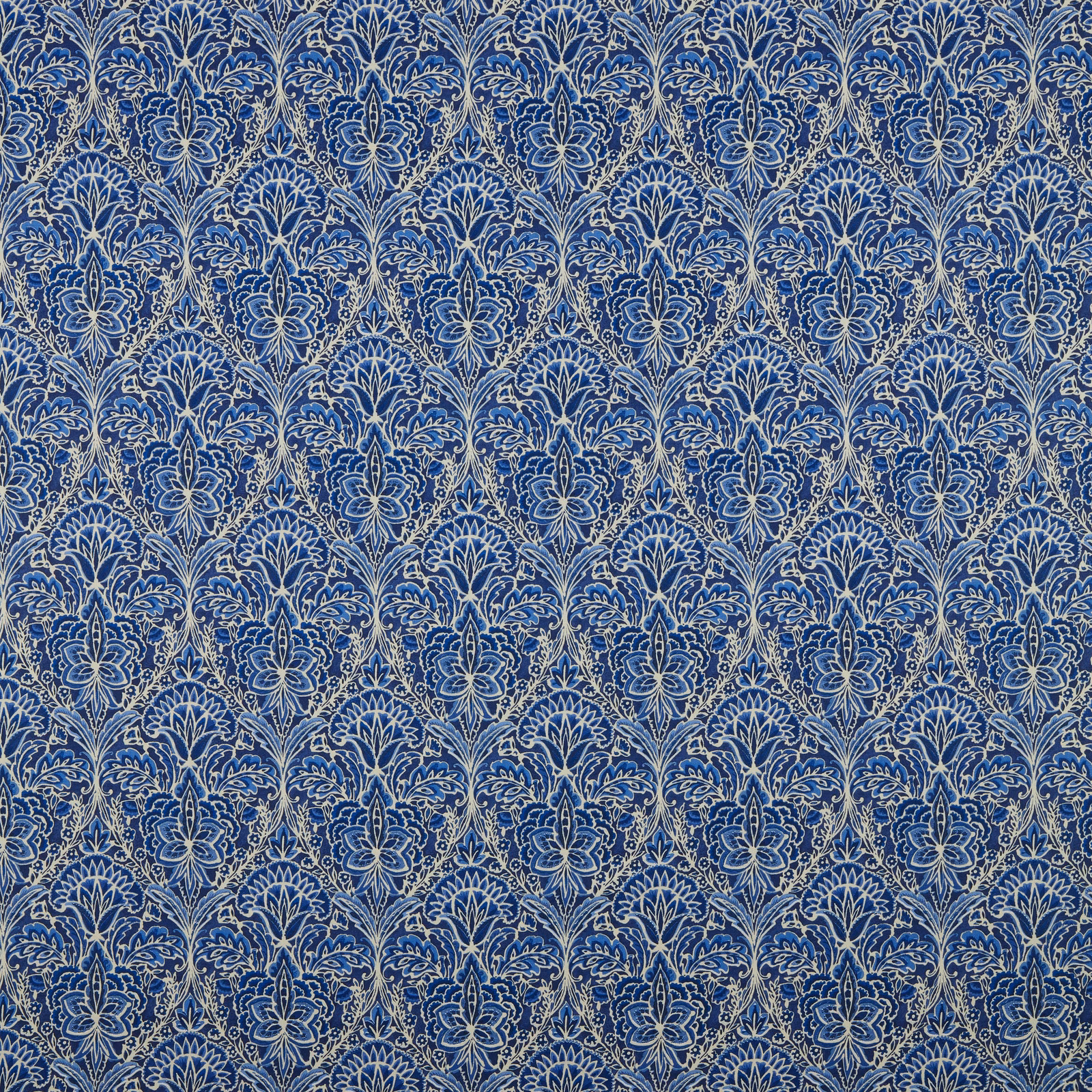 Blue damask cotton fabric with pale outlined scrolling arch motif