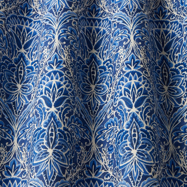 Deep cobalt damask fabric with ivory wavy leaf motifs