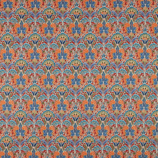 Dense ruby red floral motif with blue and teal accents on cotton fabric