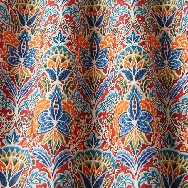 Bright ruby cotton fabric with large multicoloured floral motif and flowing wave pattern