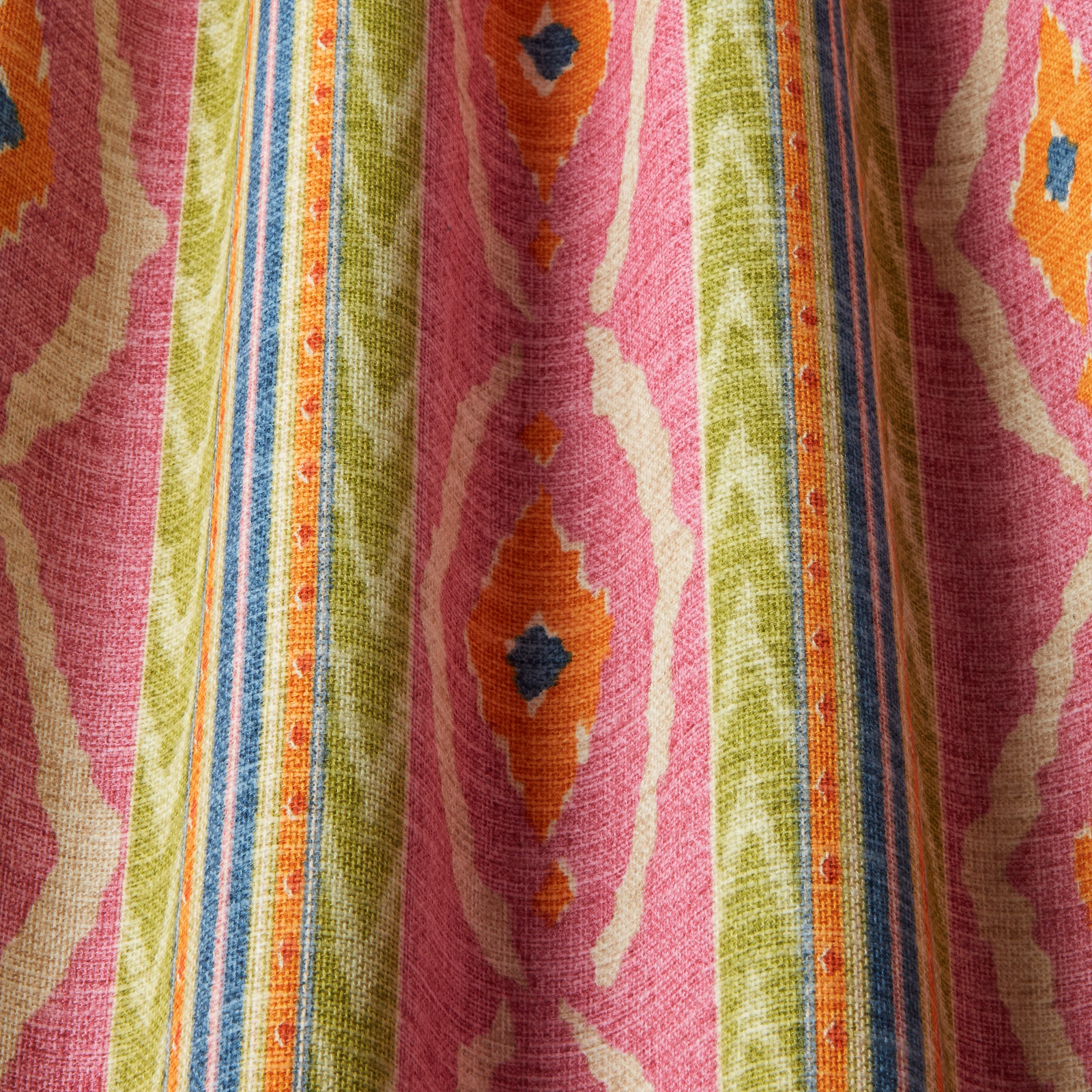 Bright hot pink wavy striped fabric with lime, orange and blue motifs