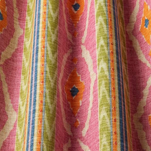 Bright hot pink wavy striped fabric with lime, orange and blue motifs