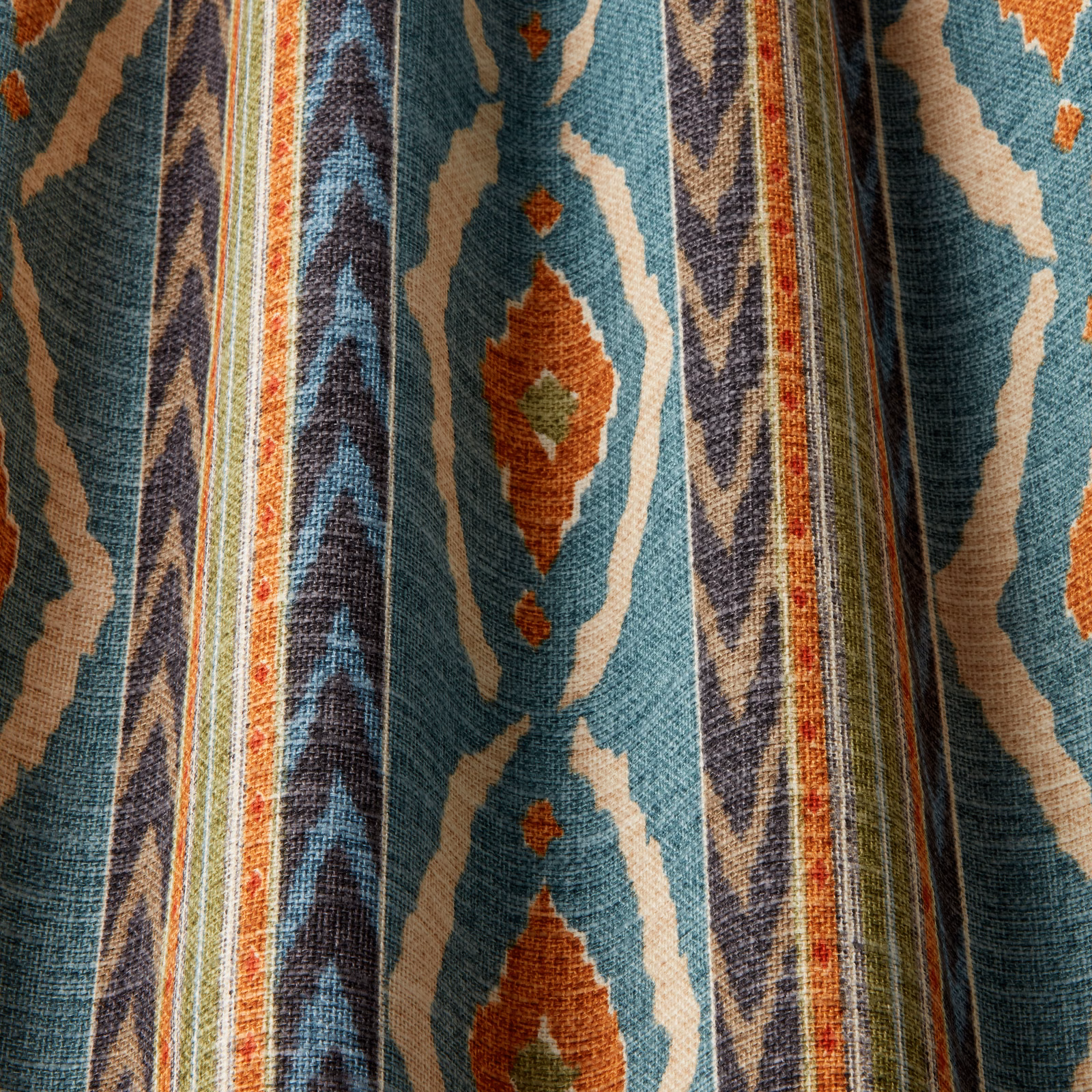 Seafoam teal woven fabric with cream and rust geometric wavy motifs