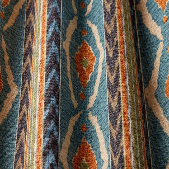 Seafoam teal woven fabric with cream and rust geometric wavy motifs