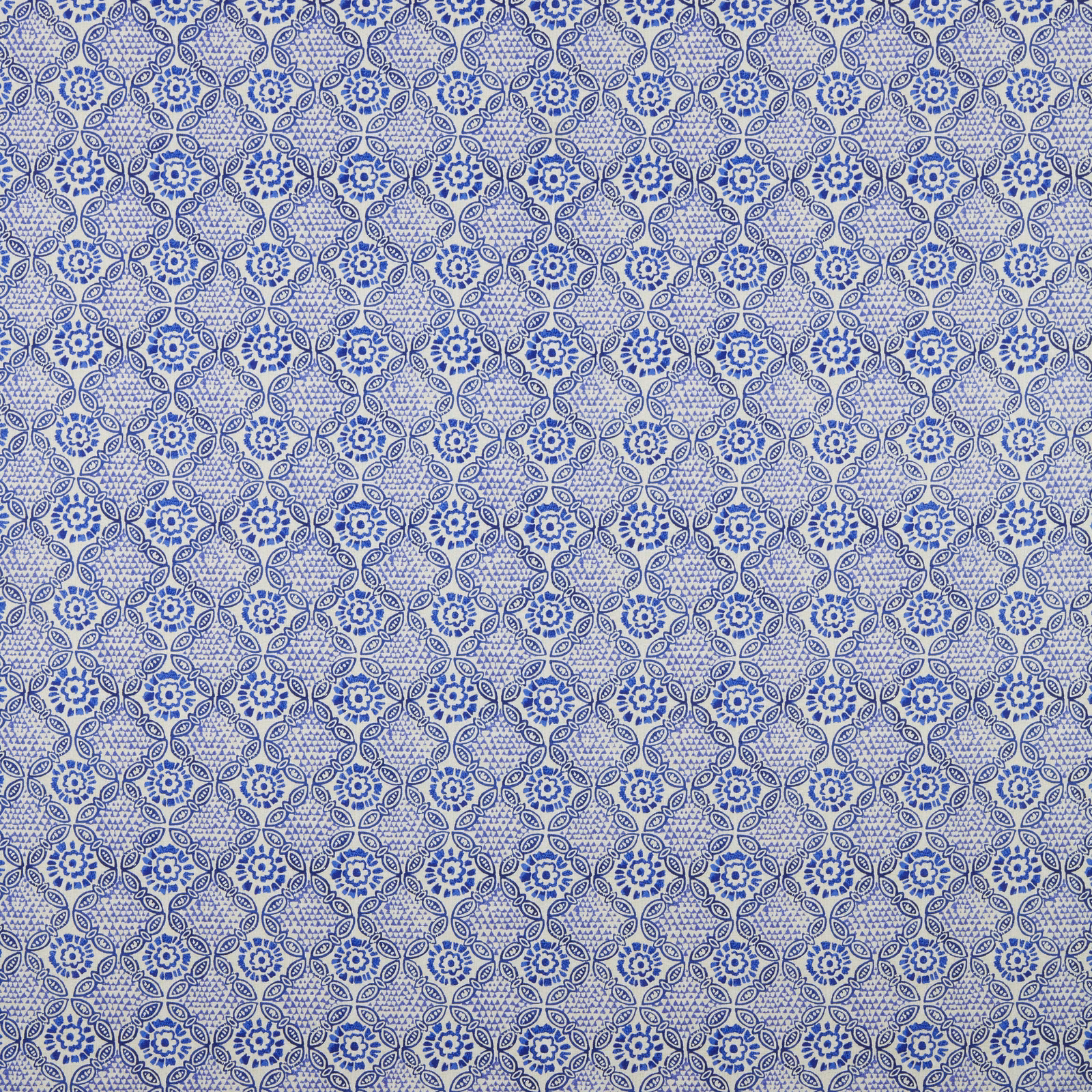 Blue batik floral cotton swatch with small repeating lattice pattern