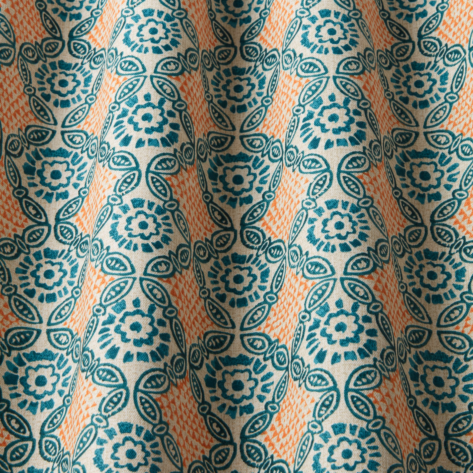 Teal and seafoam floral medallion fabric with peach diagonal wave stripes