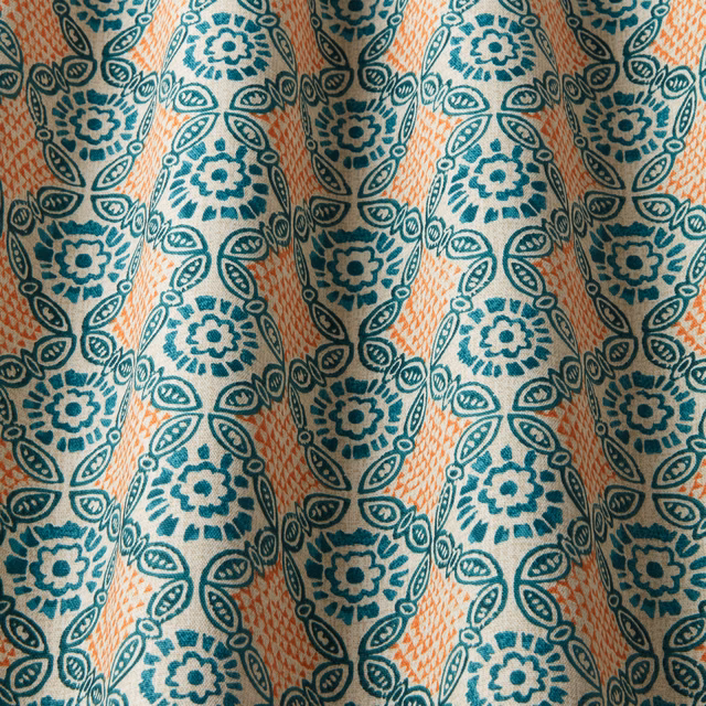 Teal and seafoam floral medallion fabric with peach diagonal wave stripes