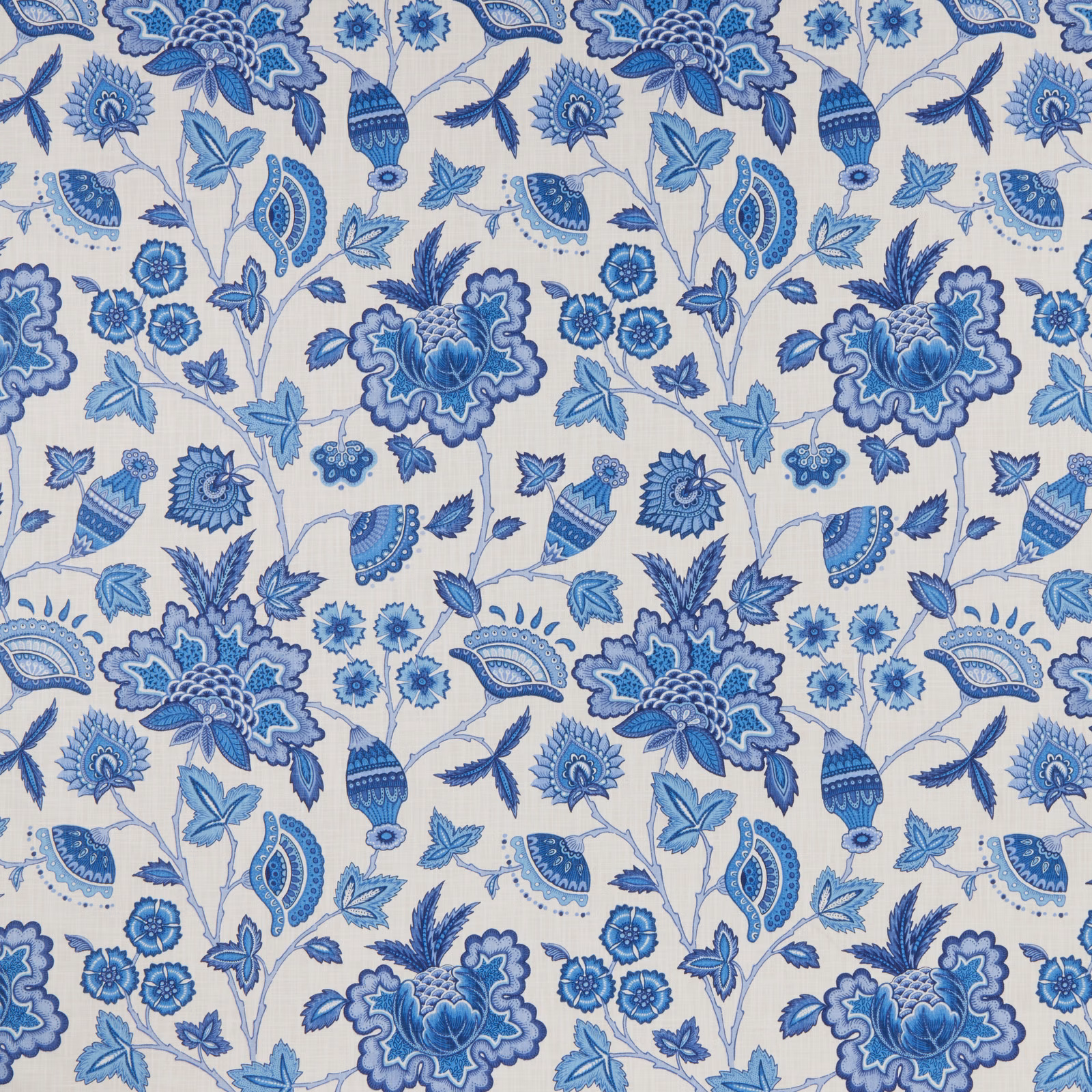 Blue botanical batik print on a pale ground with floral and leaf motifs