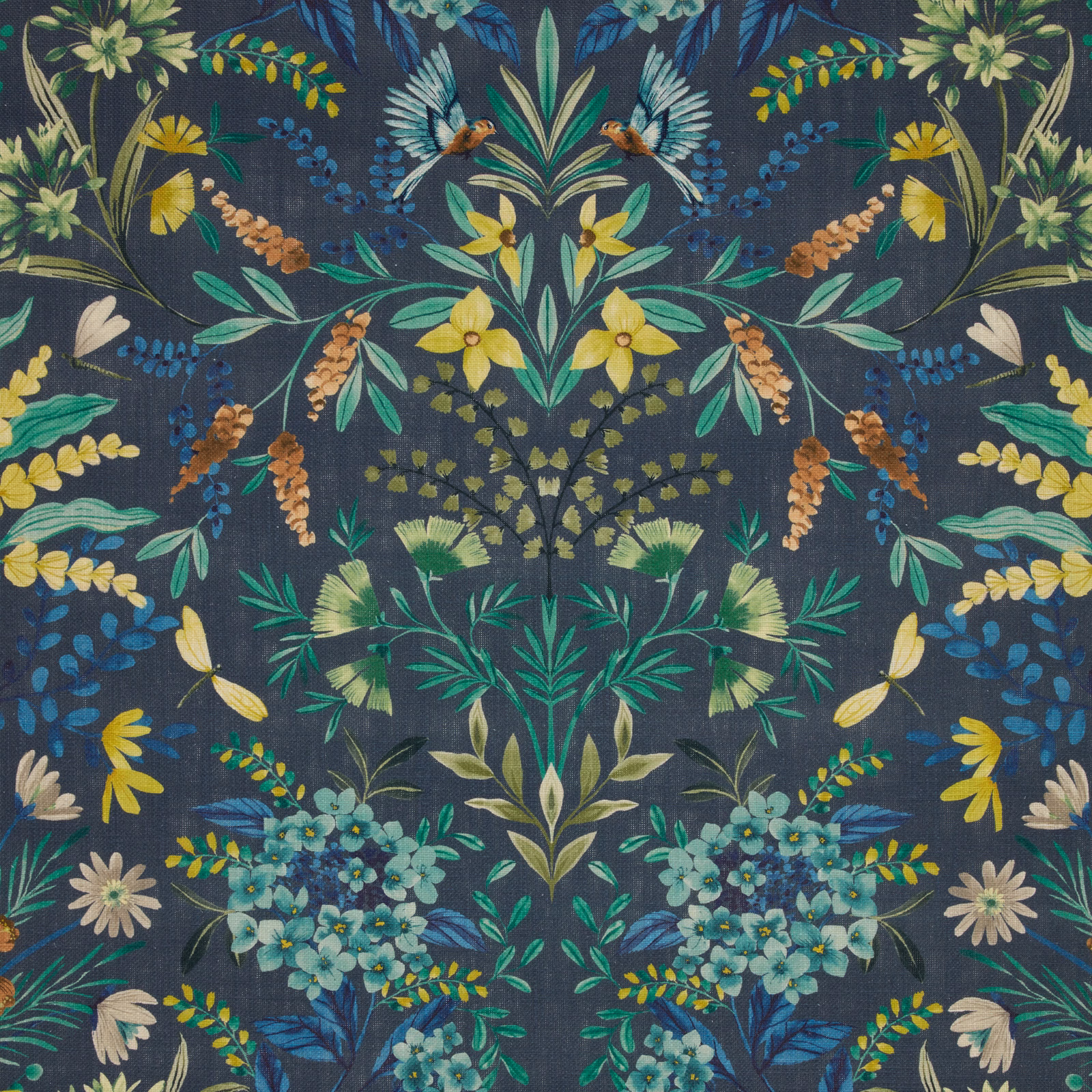 Mirrored botanical fabric on deep delft blue ground with teal, green and yellow flowers