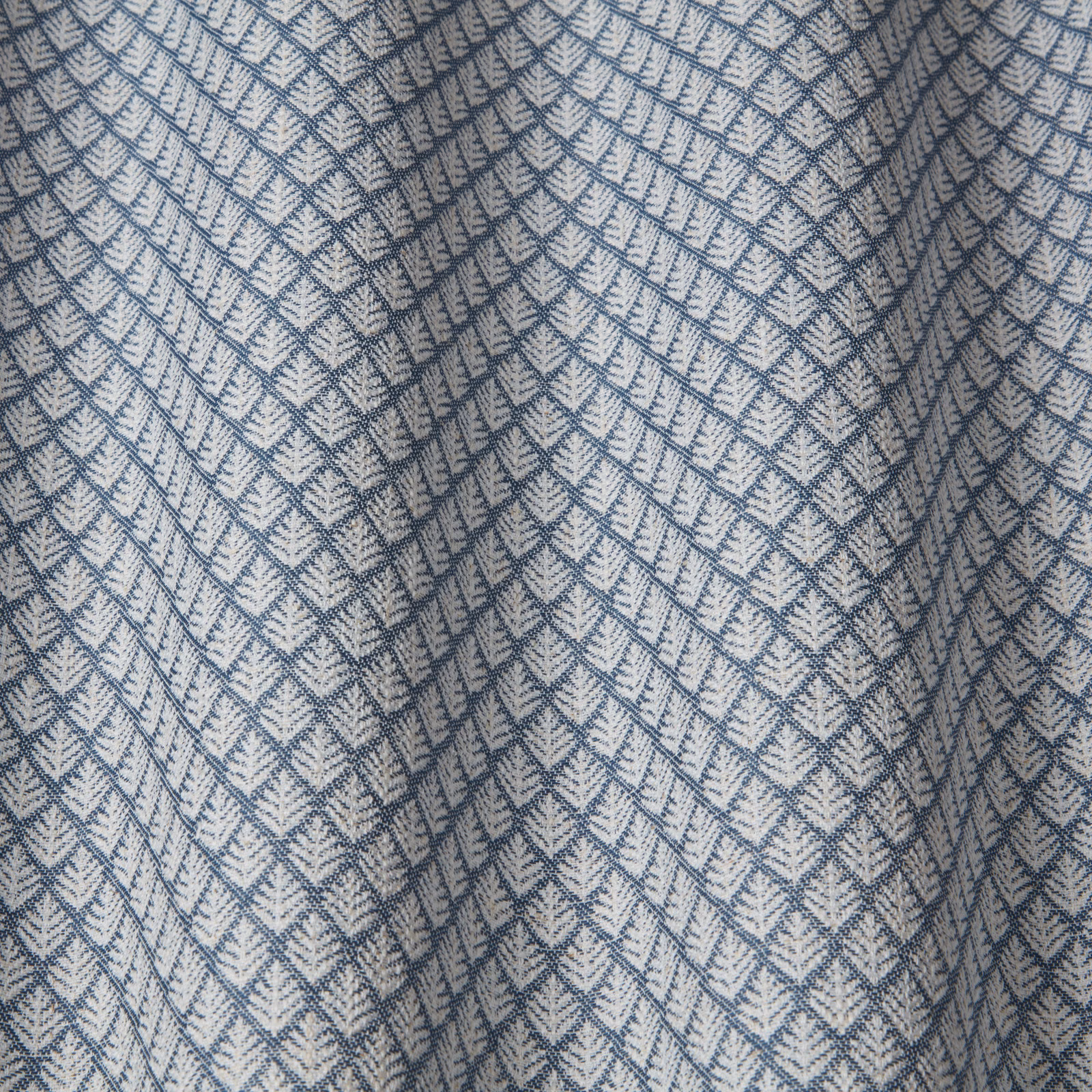 Soft denim blue geometric batik wave fabric with woven diamond pattern