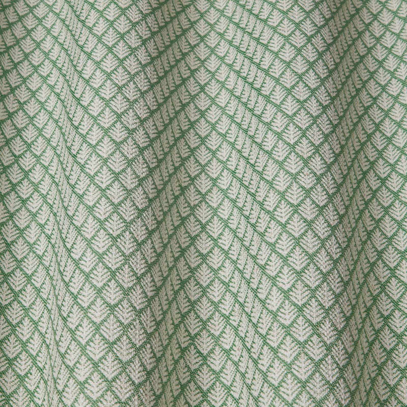 Soft sage green geometric woven fabric with wavy lattice pattern