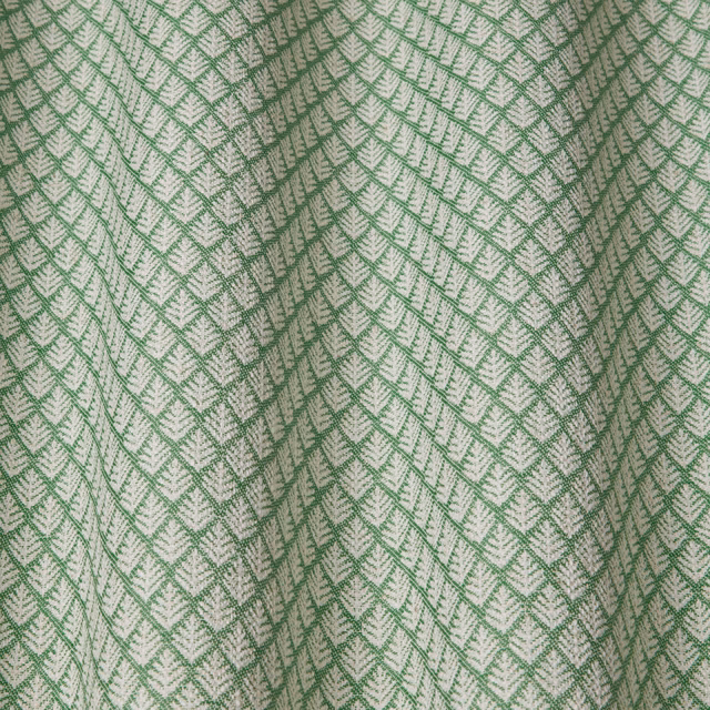 Soft sage green geometric woven fabric with wavy lattice pattern