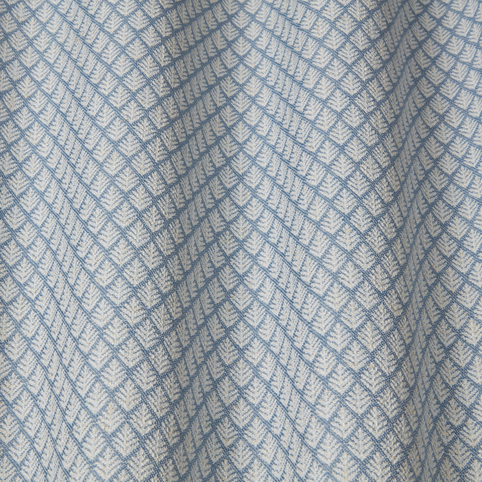 Pale blue geometric woven fabric with small diamond and chevron motif