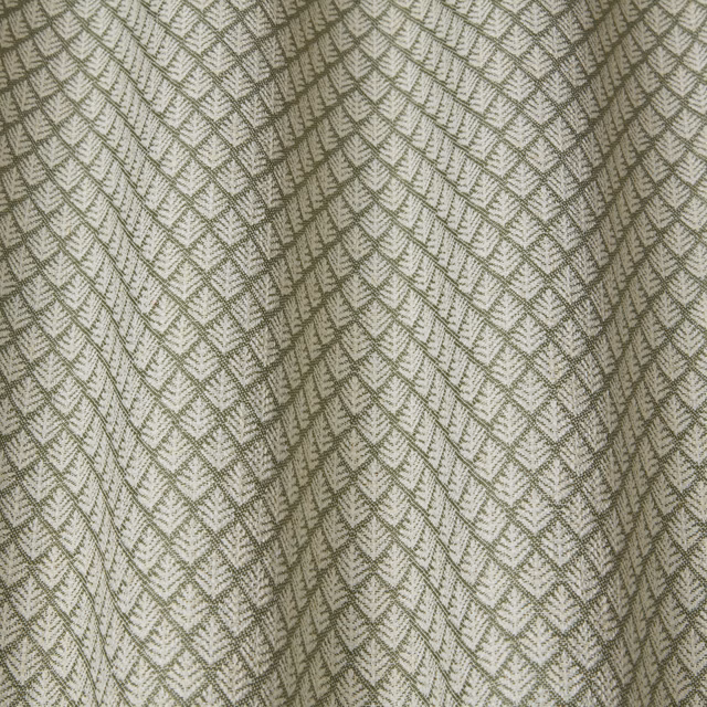 Olive green wavy geometric woven fabric on a pale ground, softly draped