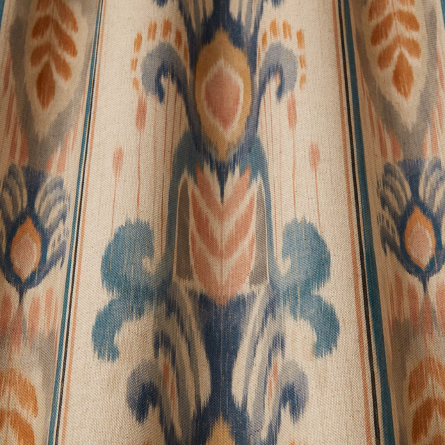 Cream woven fabric with large painterly blue and terracotta ornamental motif