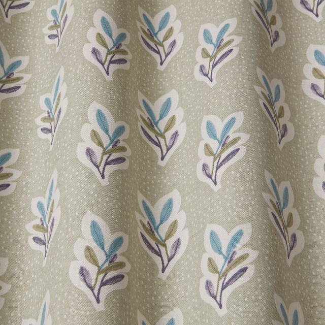 Soft sage green botanical fabric with small teal and violet leaf sprigs