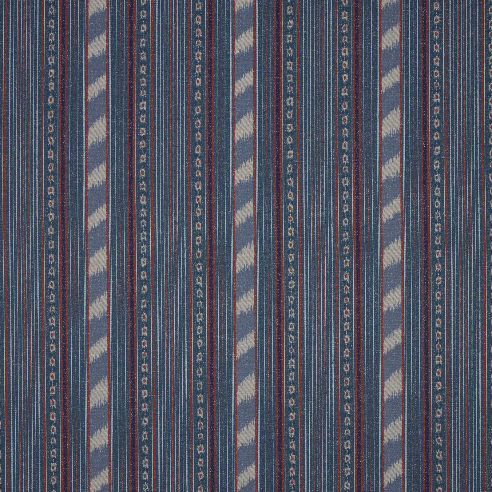 Slate blue striped fabric swatch with pale ikat bands and fine red detailing