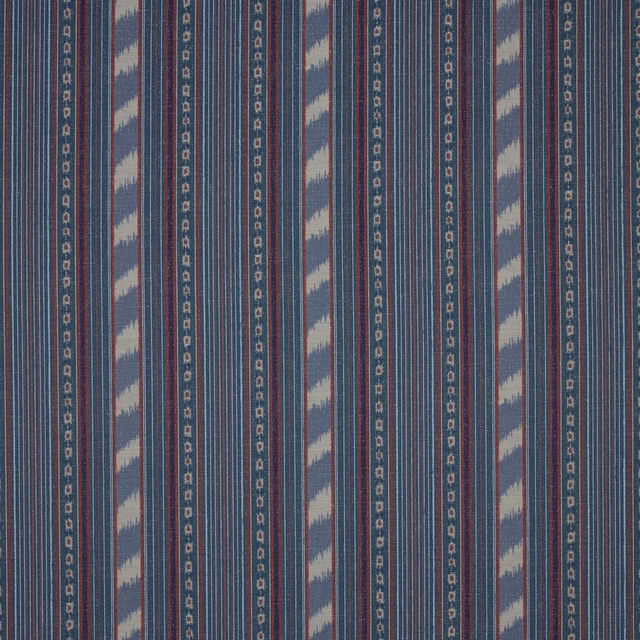 Slate blue striped fabric swatch with pale ikat bands and fine red detailing