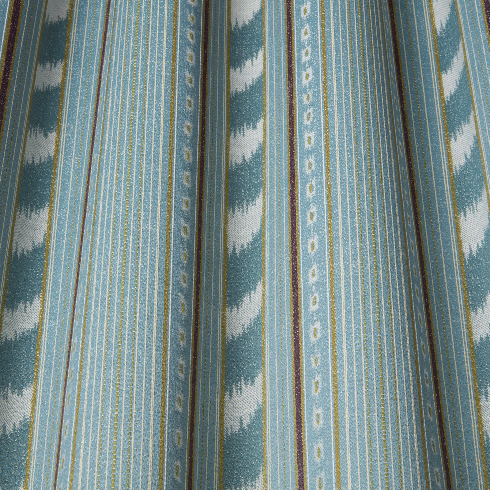 Blue and teal striped fabric with wavy zigzag bands and fine pinstripes
