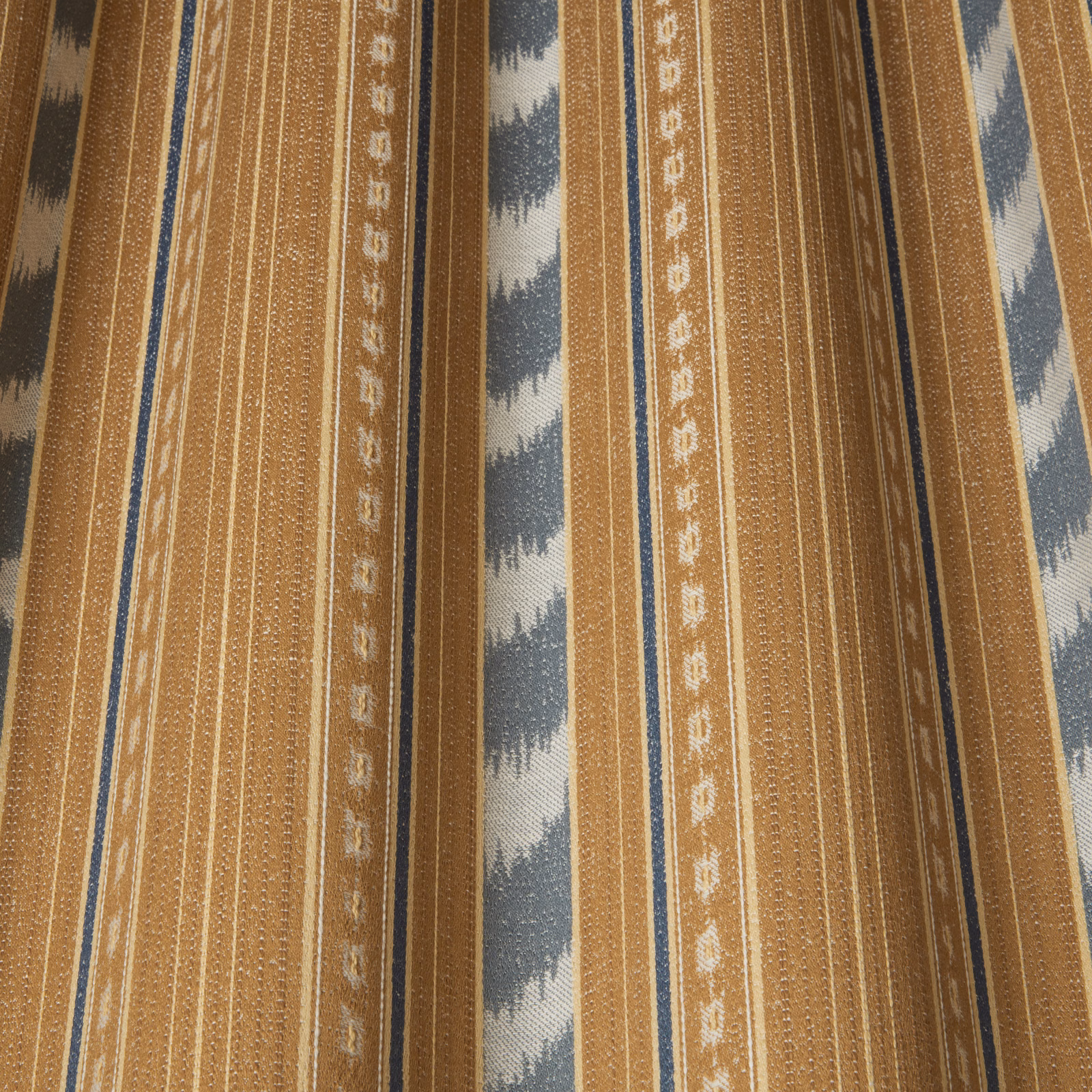Russet striped woven fabric with slate-blue zigzag motifs and cream bands