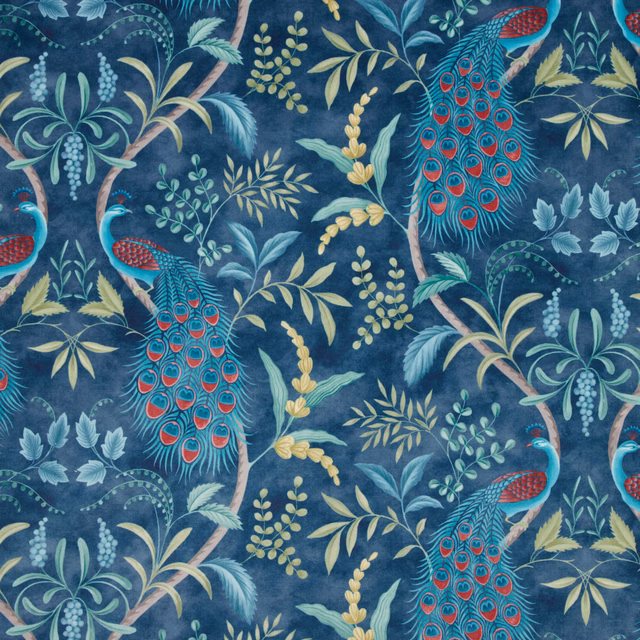 Peacock-and-foliage patterned fabric on a deep navy ground with teal, red and yellow accents