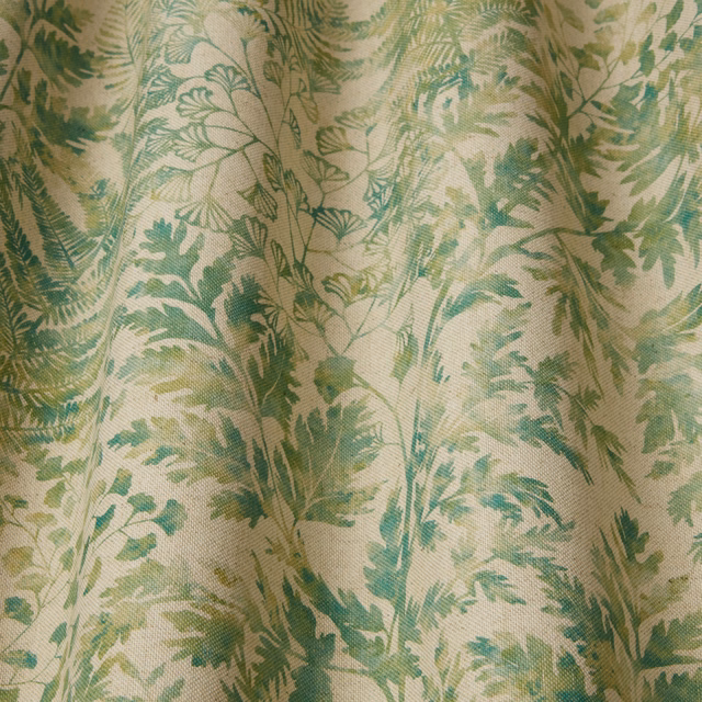 Soft sage green leafy botanical fabric with flowing fern-like print
