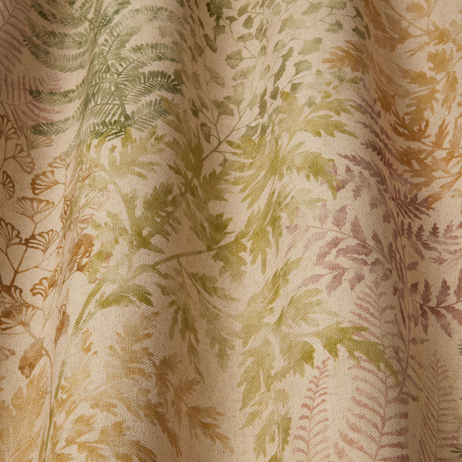 Large botanical fabric with soft beige ground, moss leaves and muted plum accents