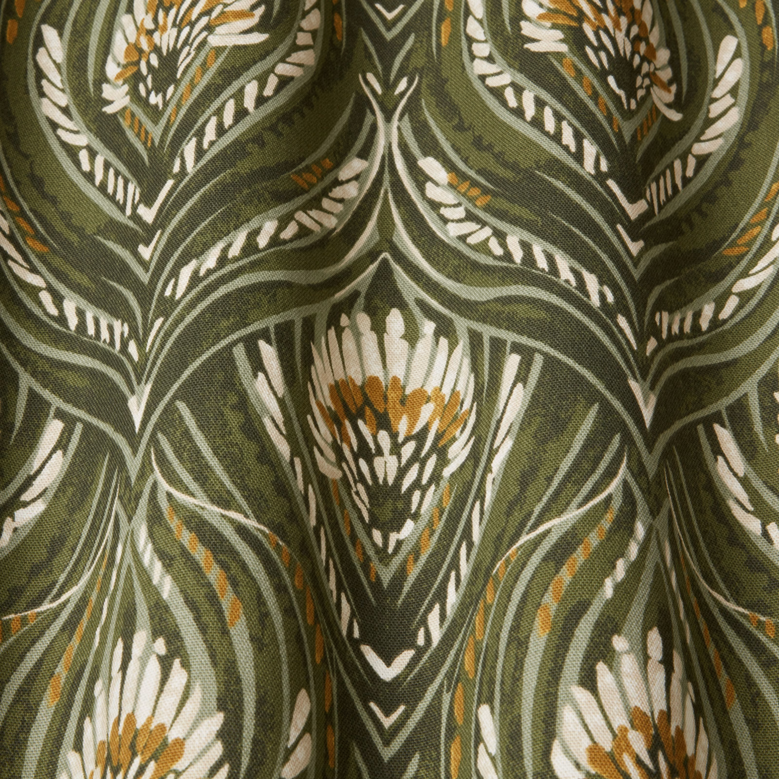 Moss green botanical fabric with ivory leaf outlines and ochre accents