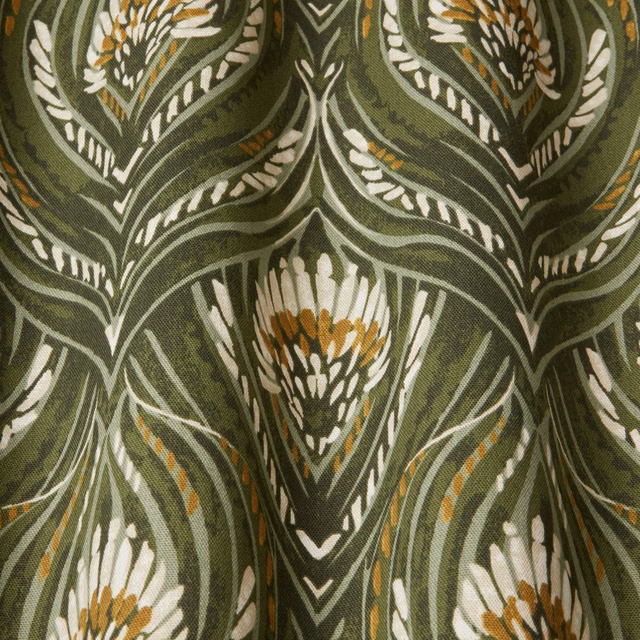 Moss green botanical fabric with ivory leaf outlines and ochre accents