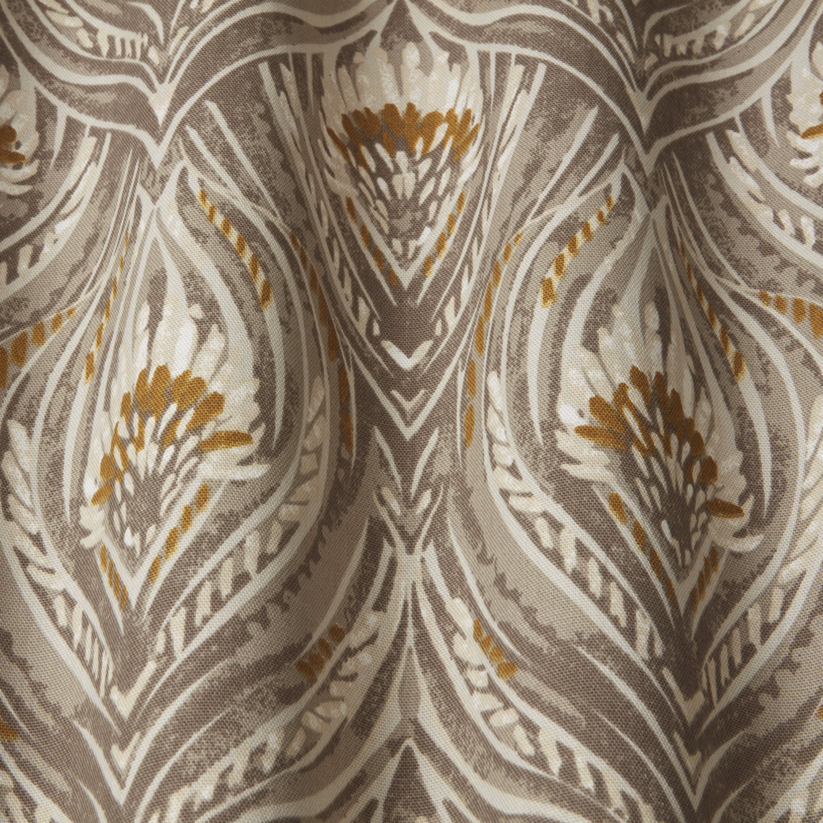 Taupe and ivory botanical wavy pattern with soft gold accents on woven fabric