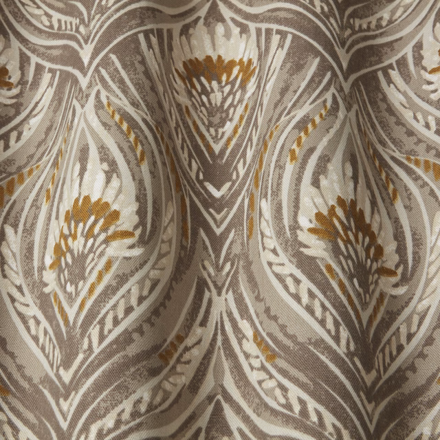 Taupe and ivory botanical wavy pattern with soft gold accents on woven fabric