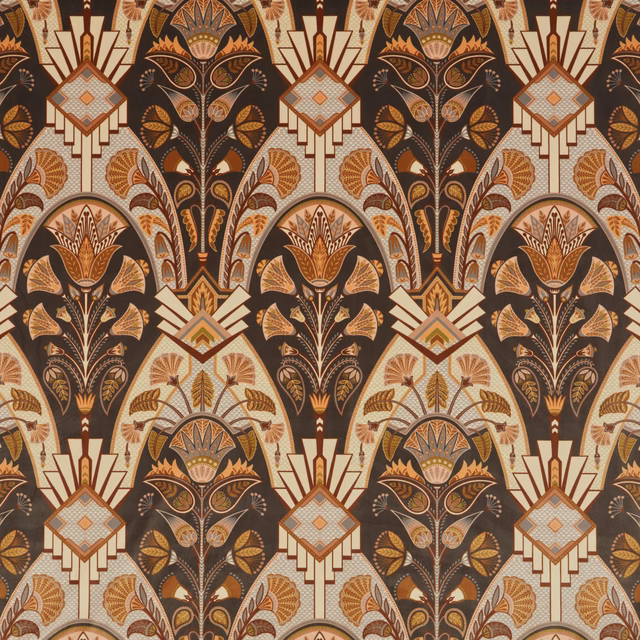 Art Deco-style fabric with amber, ivory and cocoa geometric floral motifs on a dark ground