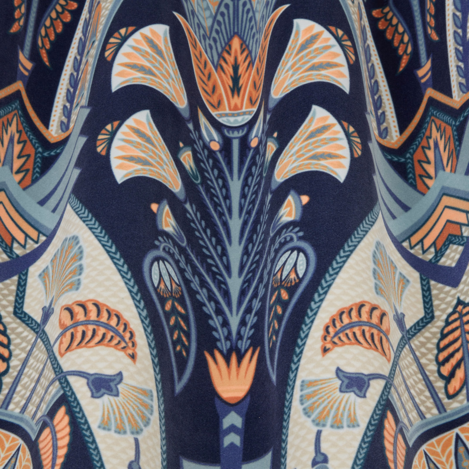 Ornate navy fabric with coral, cream and teal botanical motifs