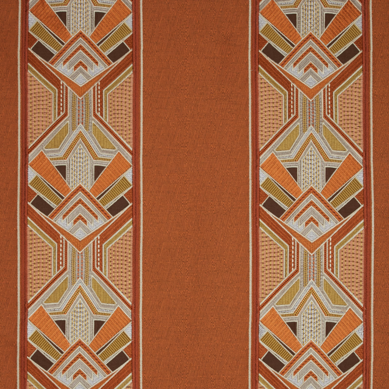Amber geometric fabric with striped border panels and a plain central band