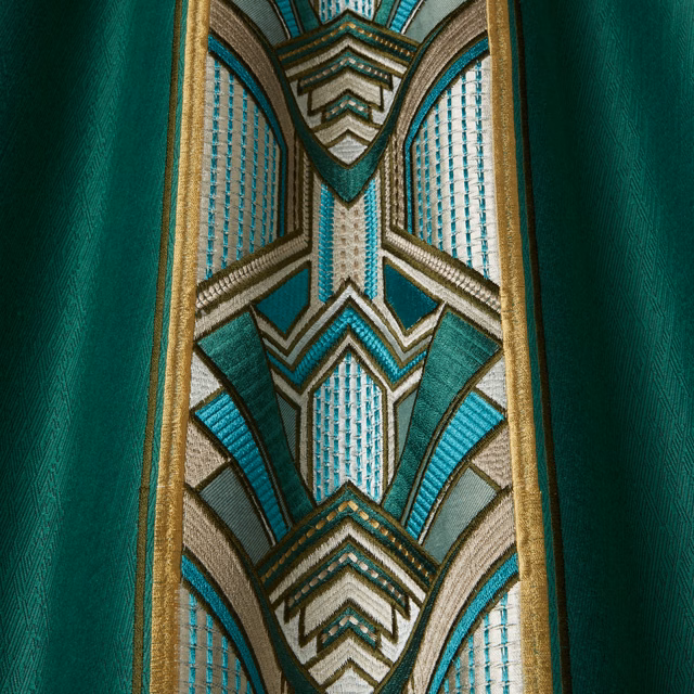 Emerald green fabric swatch with Art Deco geometric stripe in teal, cream and gold