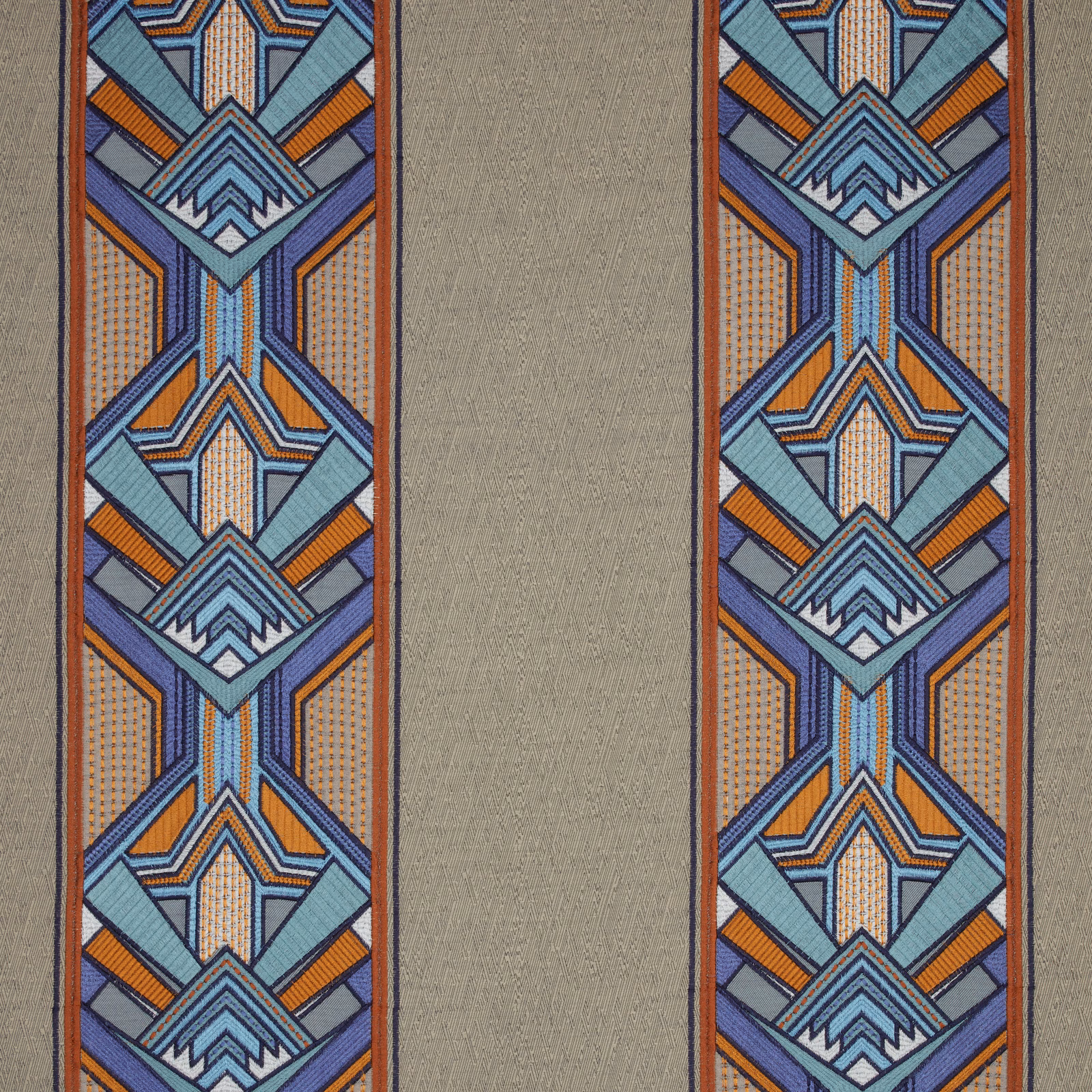 Taupe fabric swatch with bold geometric blue, teal and orange border stripes