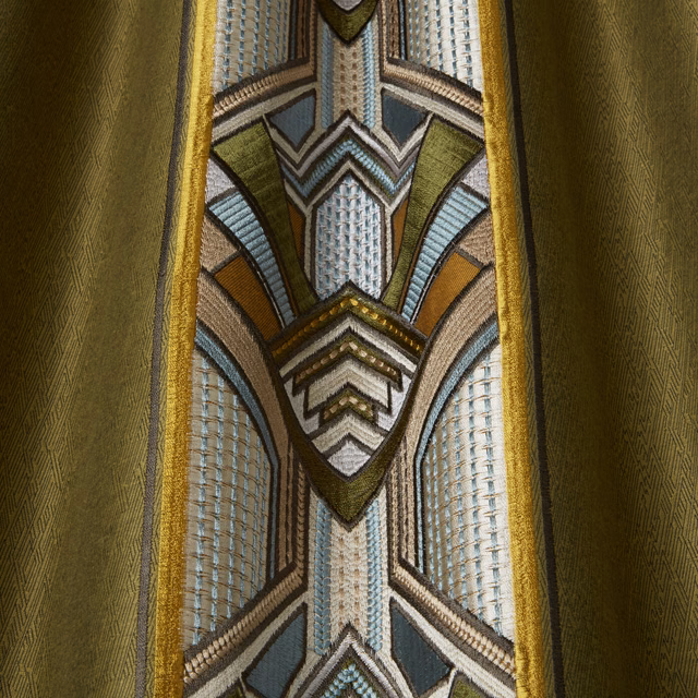 Moss green geometric woven fabric with gold borders and blue-grey accents