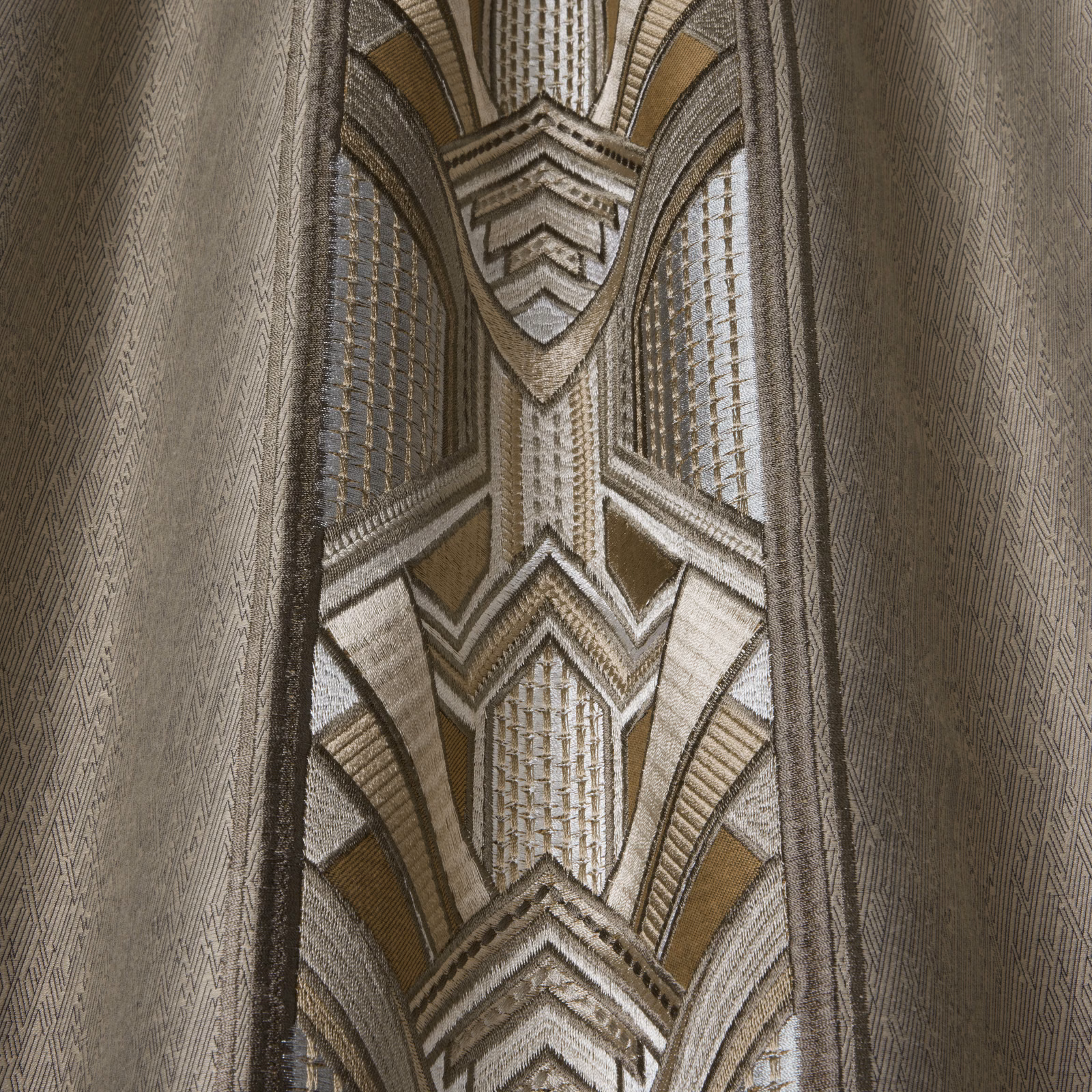 Taupe and opal geometric woven fabric with large Art Deco wave motifs