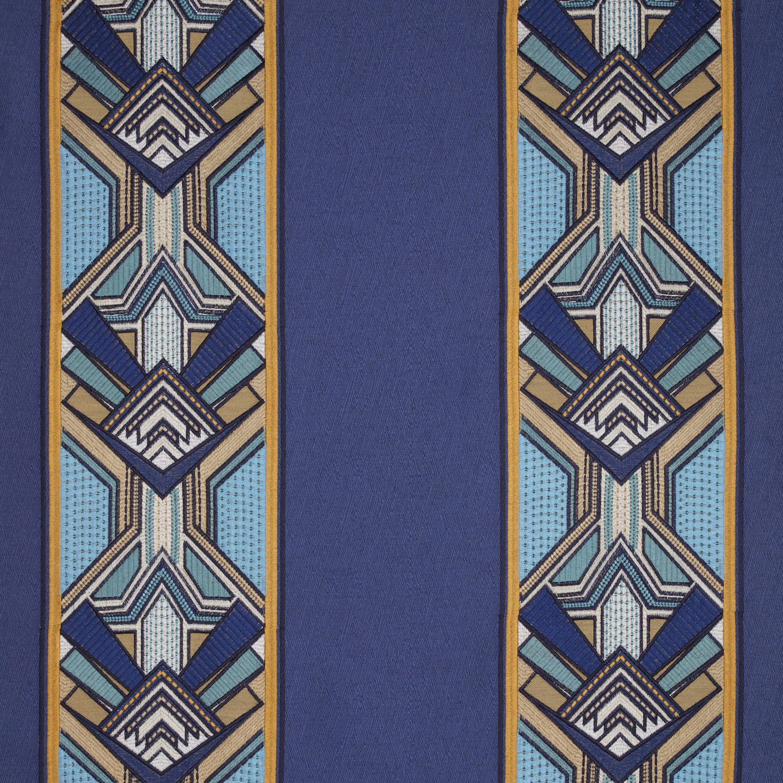 Sapphire blue fabric swatch with geometric border stripes and Art Deco motif