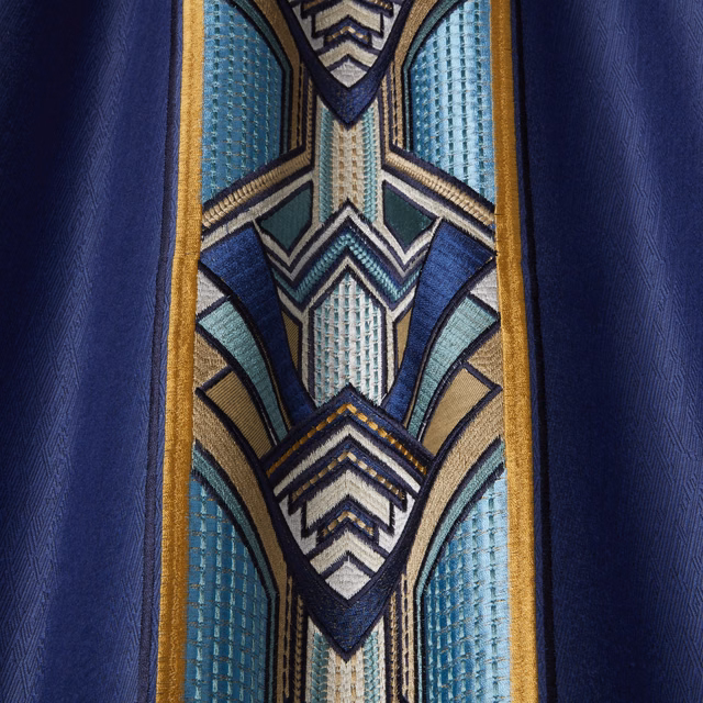 Sapphire blue geometric drapery fabric with teal, ivory and gold detailing